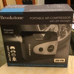 Brookstone Black and Silver Air Compressor with LED